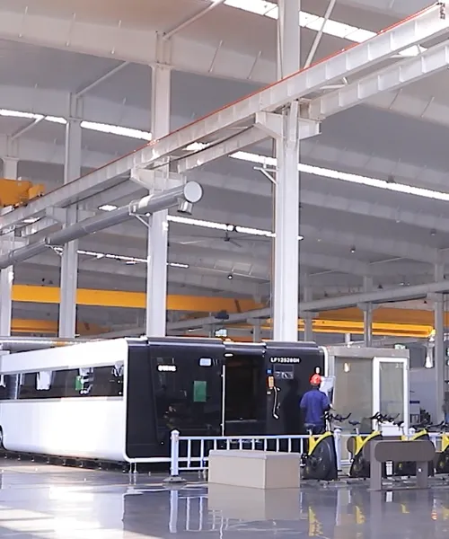 Electrical engineer inspecting large industrial diesel generator set in a modern power plant control room